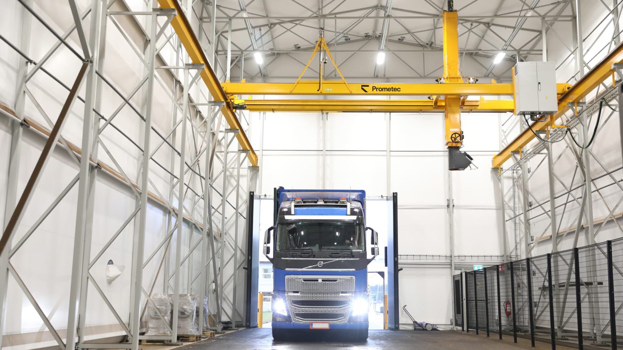 Truck entering an automated biomass fuel sampling facility for quality control and representative fuel sampling directly from the trucks.