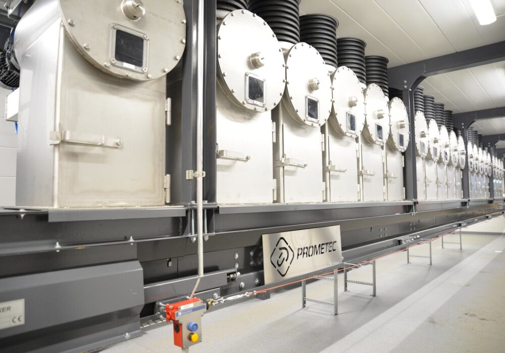 Automated sample mixing tanks used for form combined daily sample preparation and homogenization in a biomass fuel sample handling system.