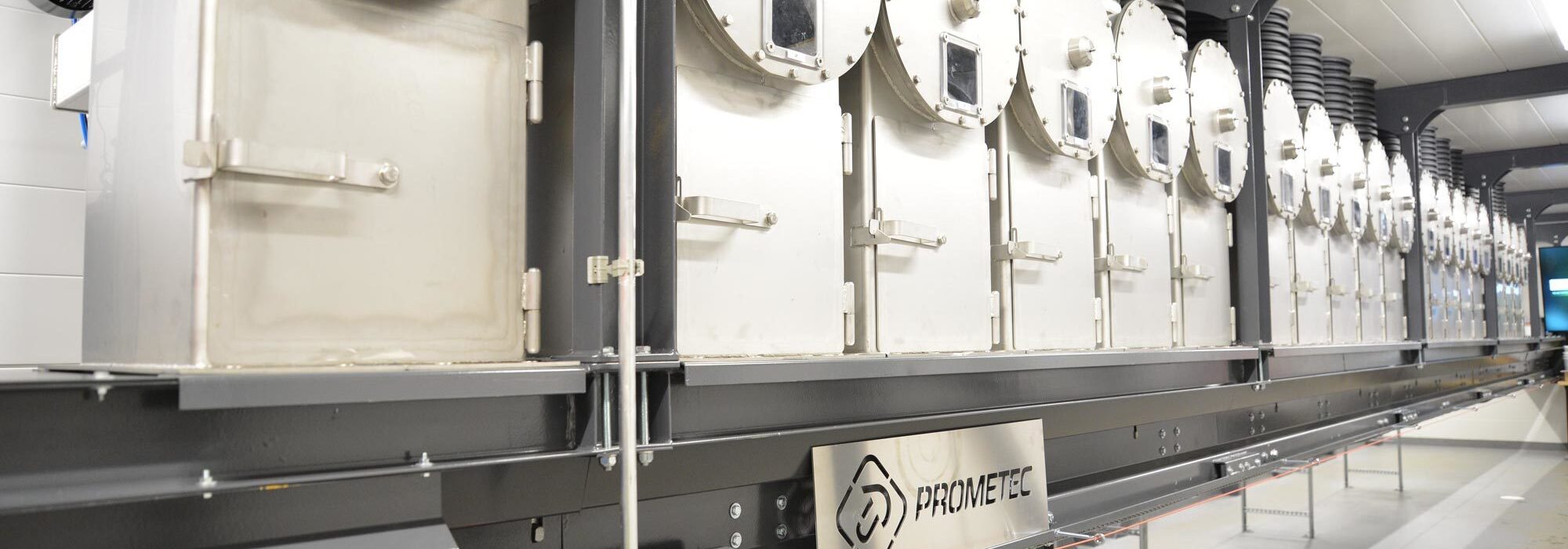 Automated sample mixing tanks used for form combined daily sample preparation and homogenization in a biomass fuel sample handling system.