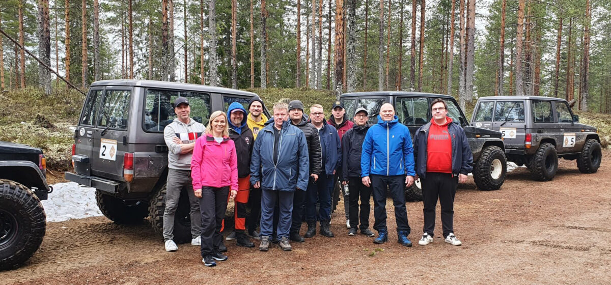 Prometec's personnel a front of the off road cars.