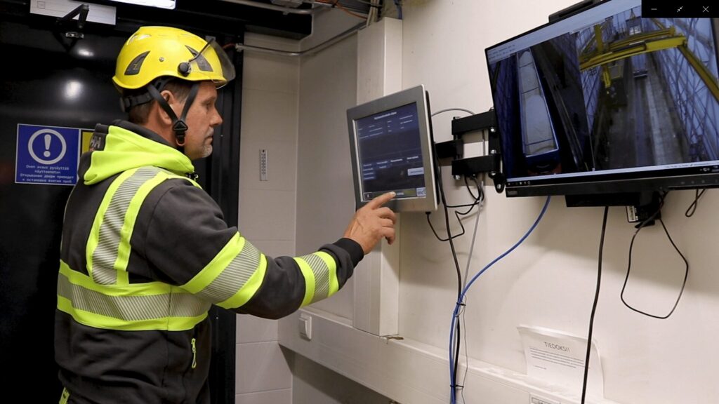 A truck driver starting Q-robot sampler from the touch screen